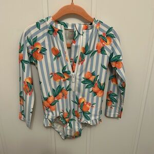 Peachy swimwear rash guard.. forget the sunscreen!